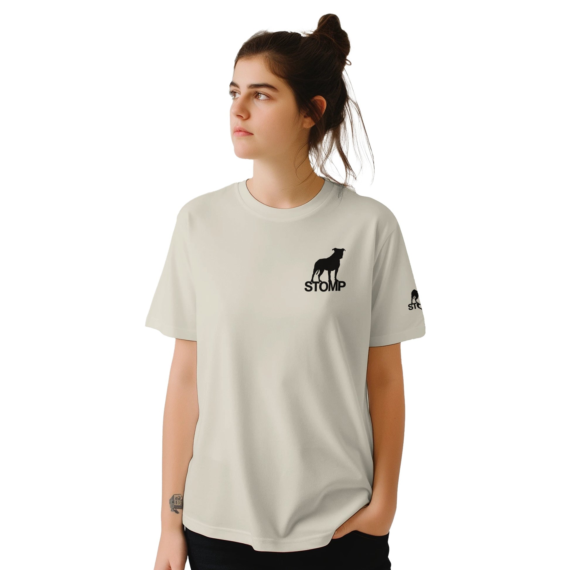 Person wearing a light gray t-shirt with 'STOMP' logo on a white background