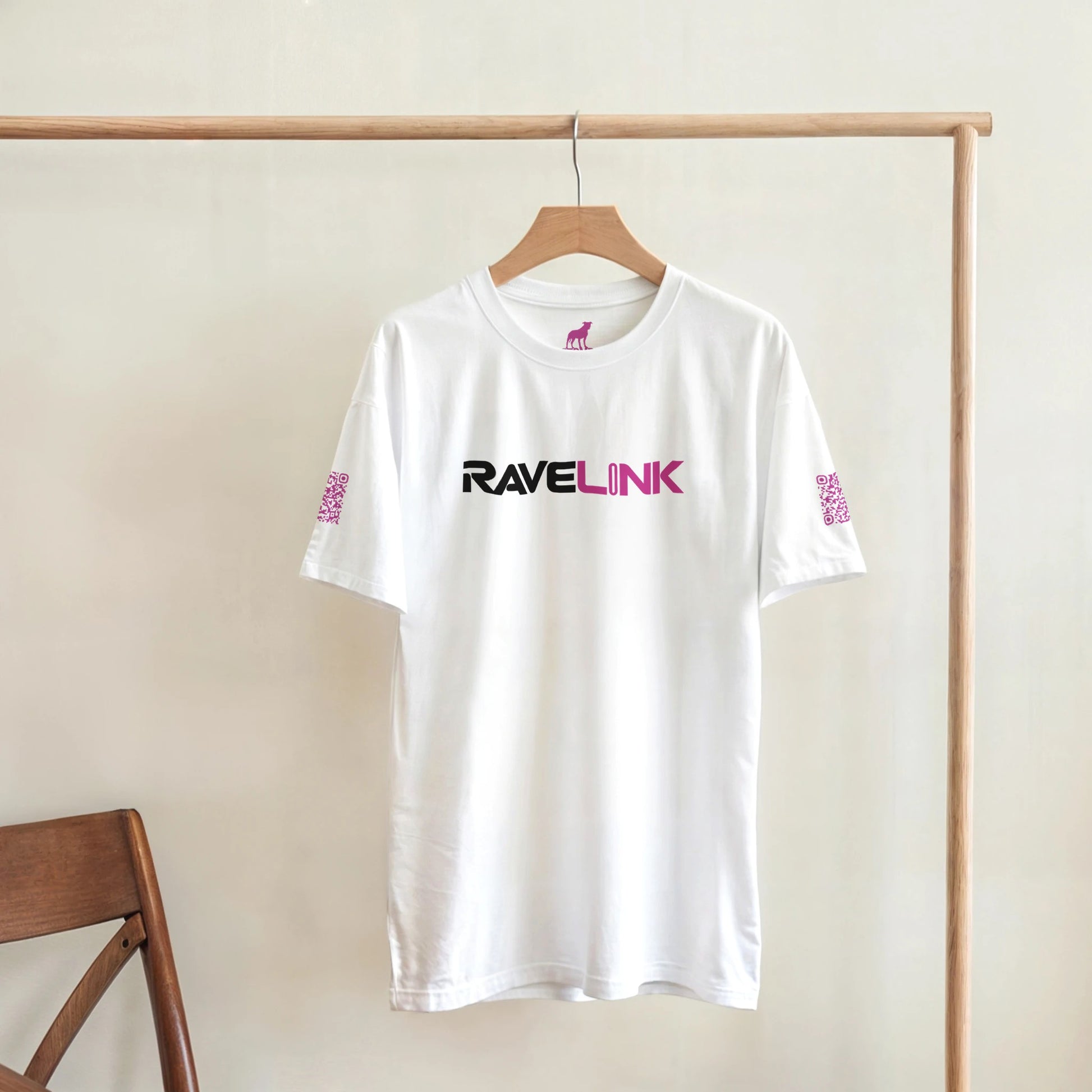 a white rave t-shirt with a pink font that is a custom Tiktok handle - custom QR Codes on each arm - RaveLink