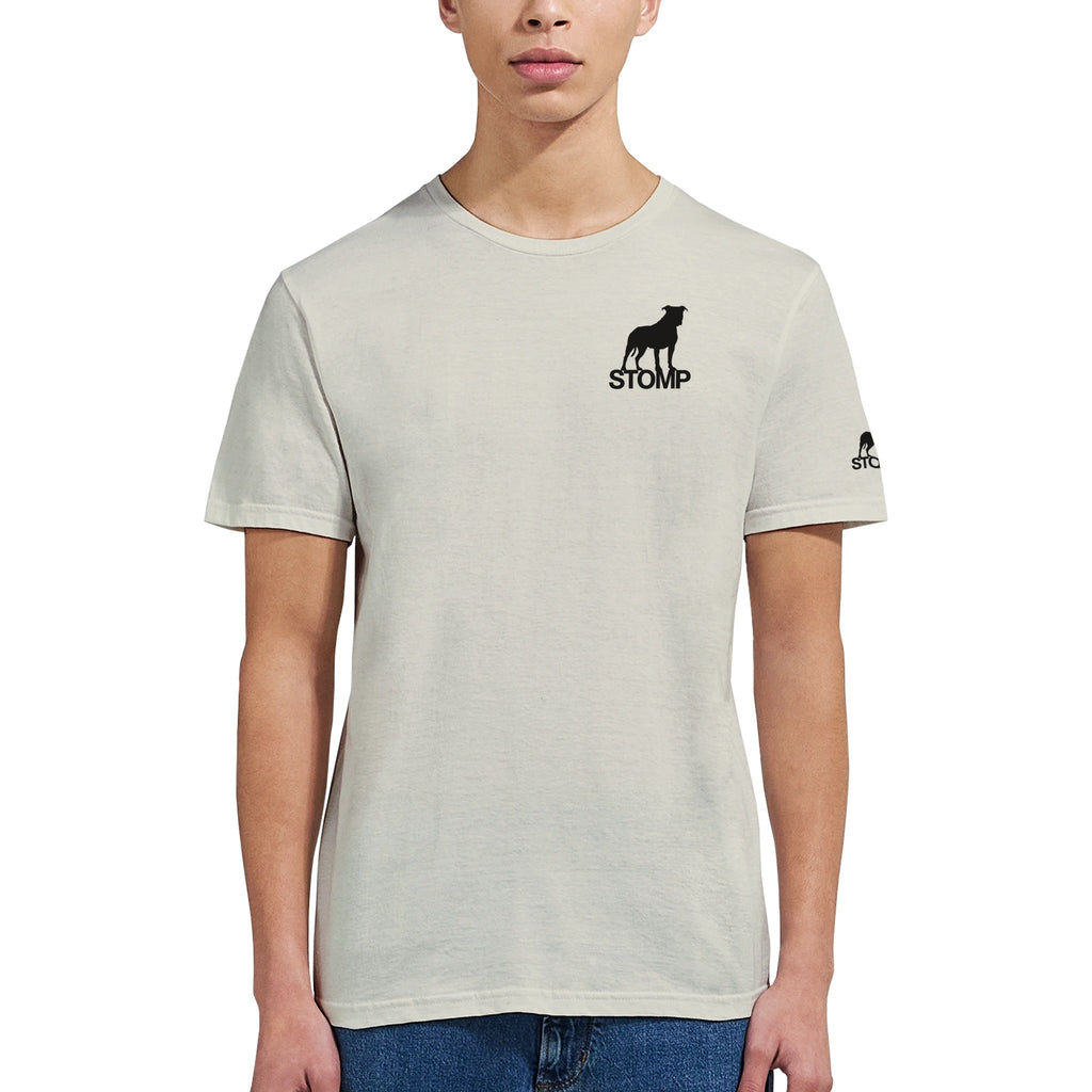 Person wearing a light gray t-shirt with 'STOMP' logo on a white background