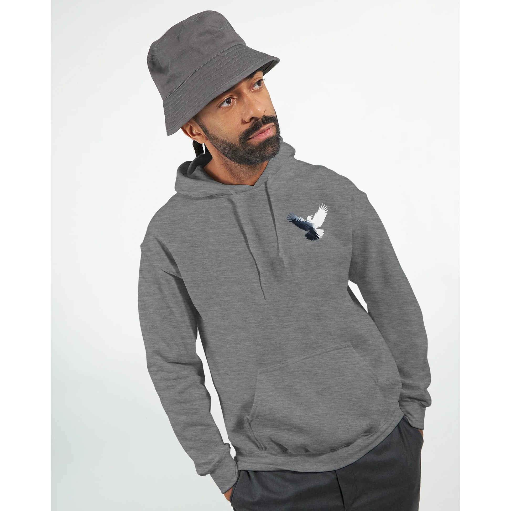 Man wearing a gray hoodie with a logo and a matching bucket hat on a white background