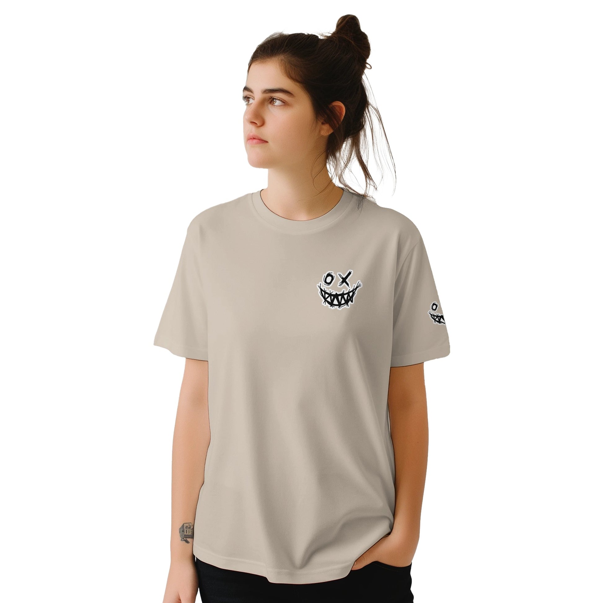 Person wearing a beige t-shirt with a smiley face design on a white background