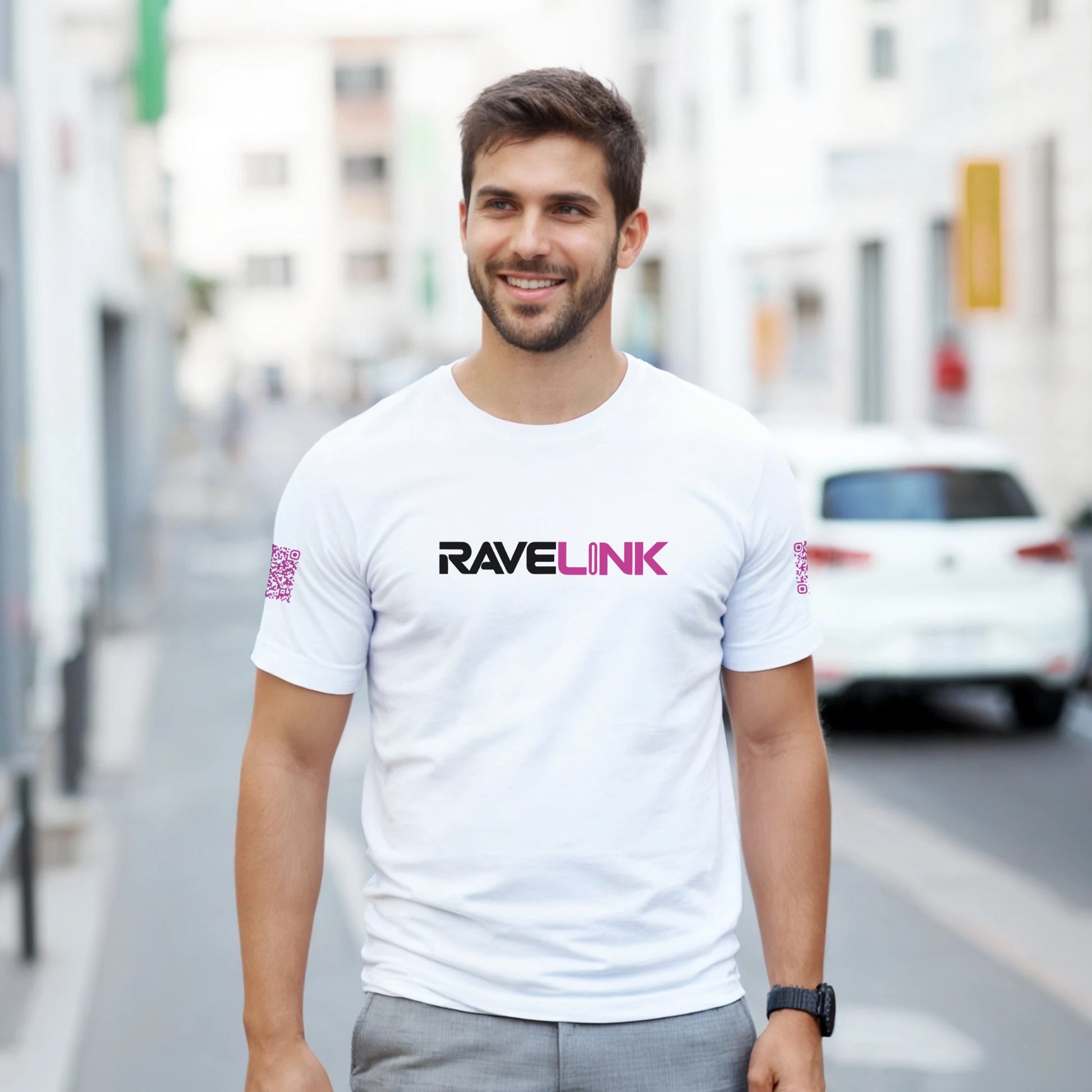 a white rave t-shirt with a pink font that is a custom Tiktok handle - custom QR Codes on each arm - RaveLink