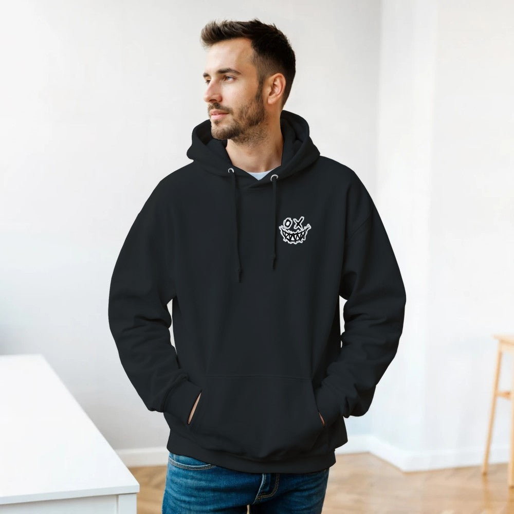 Man wearing a black hoodie with a logo in a minimalistic room. Drum and bass