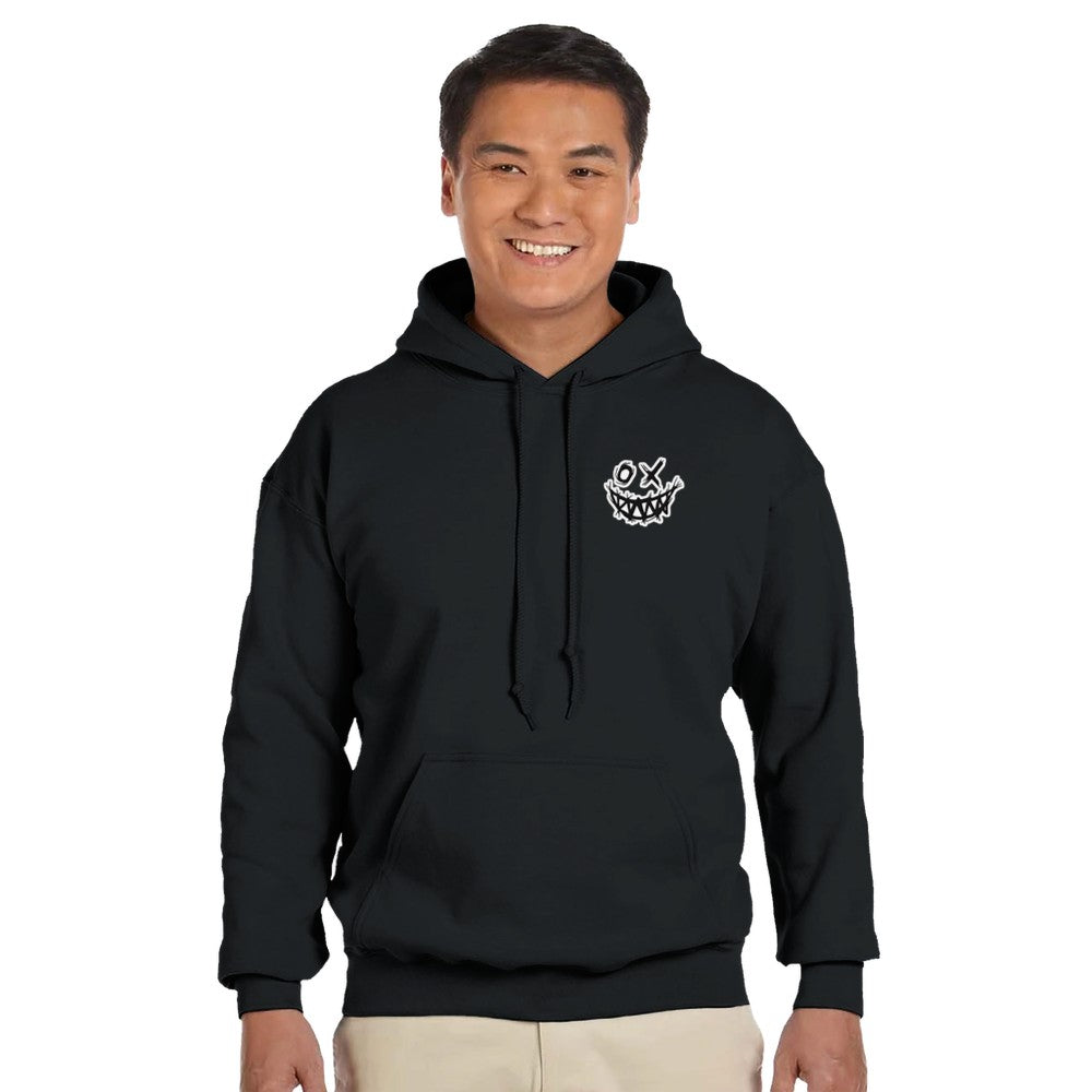 Person wearing a black hoodie with a logo on a white background. Drum and bass