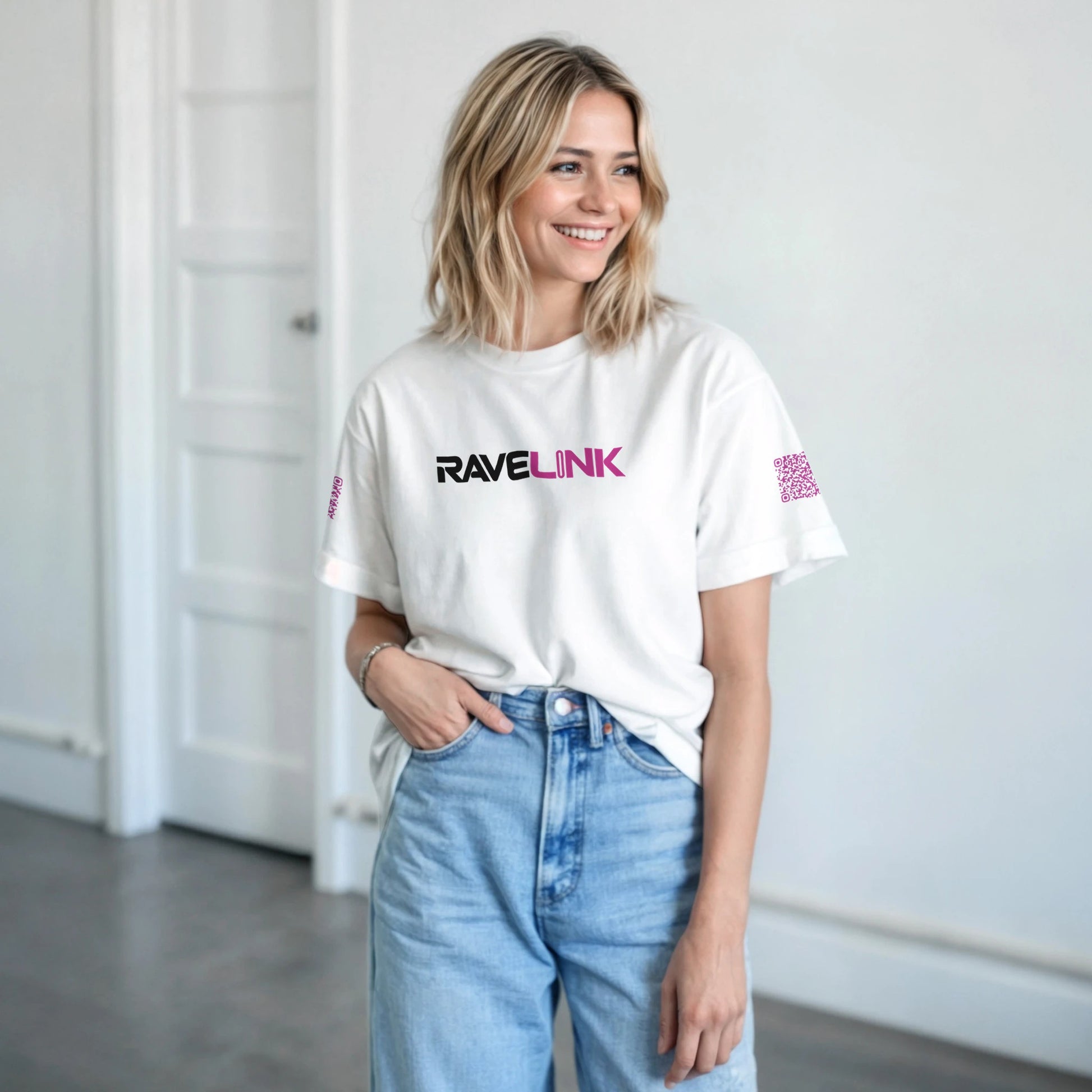 a white rave t-shirt with a pink font that is a custom Tiktok handle - custom QR Codes on each arm - RaveLink